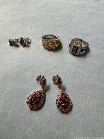 Group shot showing both rings, stud earrings and drop earrings