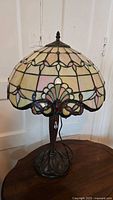 Front view of stained glass table lamp showing full shade and base