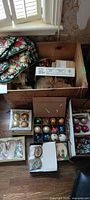 Overall lot showing crate, boxed ornaments and stockings