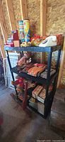 Overall shelving unit with assorted vintage toys