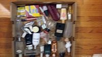 Top-down view of box containing all empty perfume bottles