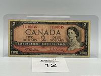 Obverse of 1954 $2 note showing serial number 91103045 and signatures