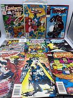 Group shot of all nine comics arranged in three rows