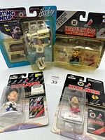 Group shot of all four packaged hockey figures