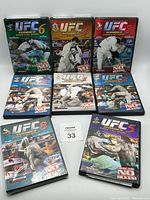 Eight UFC Classics DVD cases volumes 1-8 displayed upright