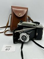 Camera and leather case front view