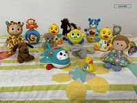 Overview of quilt and all toys arranged on top