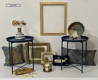 All items grouped showing tables, pillows, pie plate, vase, frames, dominoes and candle holder