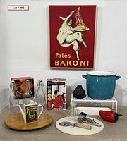 Group shot of all items including poster, stock pot, bottles, tools