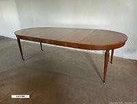 Dining table fully extended with leaves installed