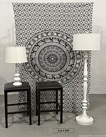 Group shot of tapestry, lamps, and stools