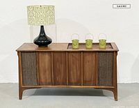 Front view of console with lamp and three lanterns displayed