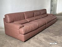 Front angled view of full Natuzzi leather sectional sofa