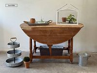 Full lot view showing table, greenhouse, galvanized items, terra cotta pots