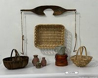 Group shot of yoke, baskets, pottery, firkin