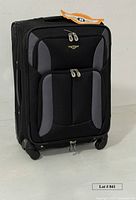 Front angled view of Rockland suitcase showing wheels and overall style