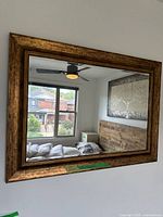 Front view of framed mirror on wall
