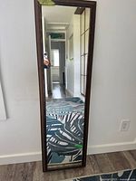 Front view of full-length mirror showing entire frame and reflection