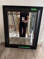 Front view of framed mirror showing frame color and beaded trim