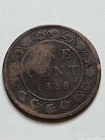 Reverse side showing ONE CENT 1859 within maple wreath