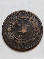 Reverse side showing crowned wreath design, date 1861 and denomination ONE CENT NOVA SCOTIA