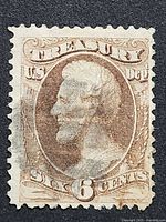 Front view of 6¢ brown Treasury Department Official stamp showing Abraham Lincoln portrait and cancellation