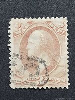 Front of 3¢ War Department official stamp with George Washington profile and cancellation mark