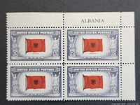 Front view of plate block showing four Albania flag 5¢ stamps with selvage