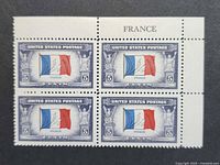Front view of complete plate block of four stamps with selvage