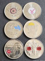 Reverse side of six commemorative quarters showing all designs and colour accents