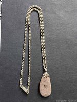 Full view of chain and pendant laid flat