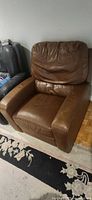 Front angle of brown pleather armchair