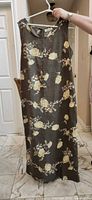 Full front view of the sleeveless floral maxi dress on hanger