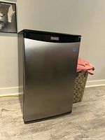 Front view of stainless steel Danby mini fridge closed