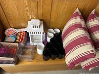 Full lot showing lantern, pillows, tea light holders, glass holders, tray, plates, coasters, tongs