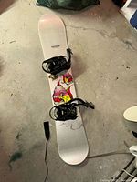 Top view of Rossignol snowboard showing bindings and graphic