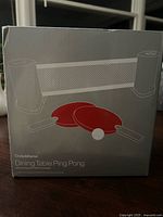 Front of sealed Crate & Barrel Dining Table Ping Pong box