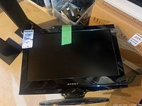 Front view of Dynex TV on stand