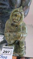 Front view of green soapstone hooded figurine