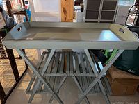 Full view of tray table showing removable tray and folding base