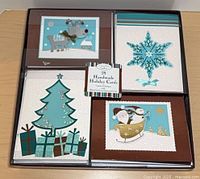 Boxed set of Hallmark Connections handmade holiday cards showing four designs