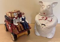 Front view of both cookie jars showing design and figures