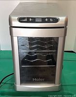 Front view of Haier wine cooler showing door and exterior