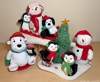 All three Hallmark Jingle Pals figurines grouped together on tabletop