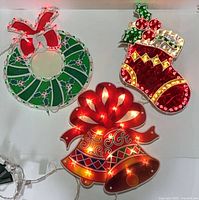 All three lighted window decorations displayed together showing scale and design