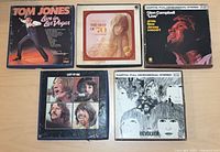 Front view of five reel-to-reel tape boxes