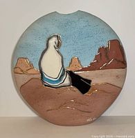 Front view showing seated Indigenous woman scene on vase