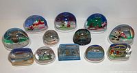 Group view of all twelve snow globes showing size and variety