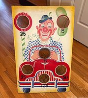 Front view showing clown graphic, scoring holes, general condition