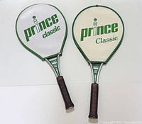 Both Prince Classic racquets with covers front view